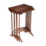 A nest of three mahogany tables on spindle turned supports and splay feet,