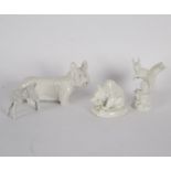 Four 20th Century Meissen white glazed animals comprising squirrel, calf, terrier and bear,