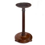 A mahogany jardinière stand with reeded column on a circular base,
