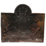 A cast iron fireback with arch cresting bearing the Royal cipher and dated 1664,