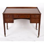 A George IV mahogany kneehole washstand with galleried border fitted a surround of five drawers on