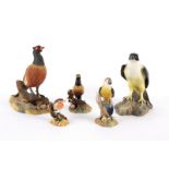 A Royal Crown Derby figure of a falcon, another of a pheasant, a smaller pheasant,