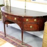 A mahogany and boxwood strung half-round sideboard, on square tapering legs and spade feet,