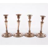 A set of four old Sheffield silver plated candlesticks of oval tapering form, 30.