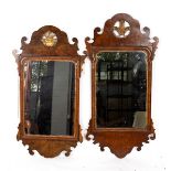 Two Georgian walnut fret carved wall mirrors,