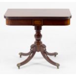 A Regency mahogany tea table, the fold-over top on a turned column and hipped outswept legs, 91.