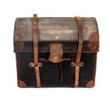 A dome top trunk with leather straps,