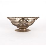 An oval silver basket, London 1891, the pierced sides with swag decoration, 22.