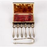 A set of six Dutch silver teaspoons and the matching sugar tongs, 1822 with pointed terminals,