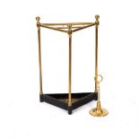 A brass corner stick stand, with cast iron base,
