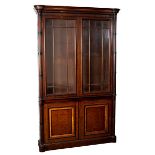 A Regency mahogany bookcase in the manner of Gillows with satinwood banding,