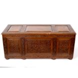 A carved oak chest with hinged cover, 124cm wide CONDITION REPORT: Carved chest,