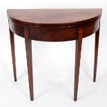 A George III half round tea table on square tapering legs,