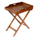 A butler's mahogany tray with folding stand,