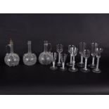 Three engraved Dutch glass decanters, two opaque twist ale glasses,