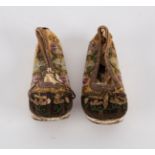 A pair of Chinese child's shoes embroidered with flowers
