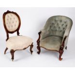 A Victorian button back tub armchair on carved front legs and another Victorian chair with carved