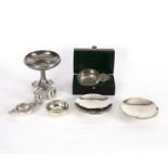 A small group of Robert Welch pewter table items comprising two hammered footed dishes,