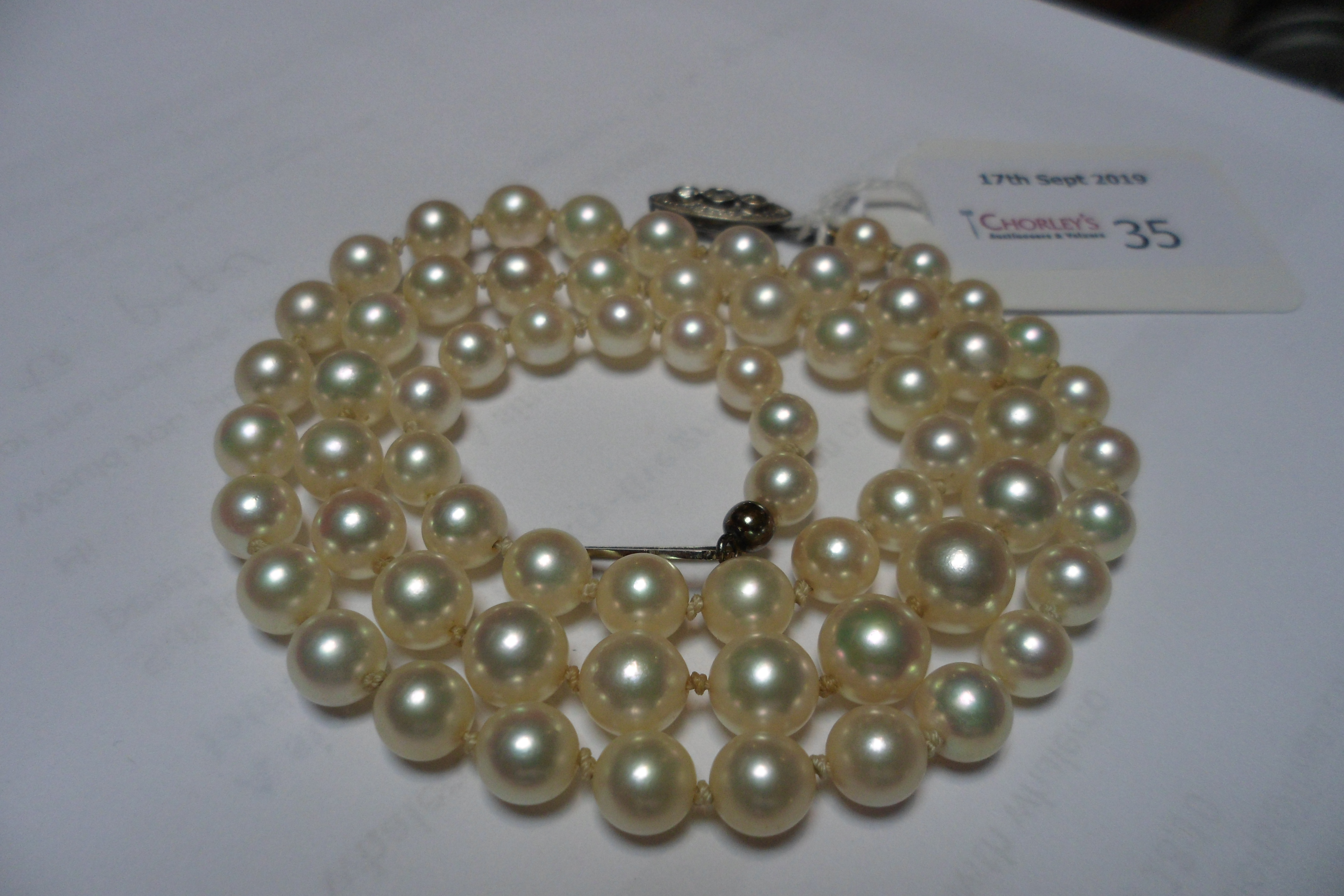 A single row of sixty-five graduated cultured pearls, 6mm to 9mm, - Image 5 of 7