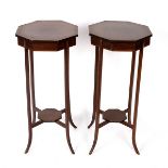 A pair of Edwardian octagonal topped stands with four outsplayed legs joined by an X stretcher, 73.