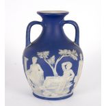 A Wedgwood blue jasper Portland vase, 1800-1840, impressed Wedgwood on uncoloured base, 25.