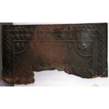 A cast iron fire back,