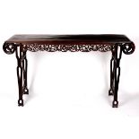 A Chinese altar table, the top with inlaid line, scroll ends and pierced frieze on end supports,