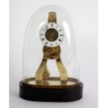 A small brass skeleton clock, late 19th Century, with an enameled chapter ring, under a glass dome,