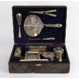A Chinese silver coloured metal dressing set of eleven pieces, stamped Tuck Chang,