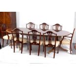 A Regency style mahogany and rosewood crossbanded dining table,