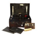 A Mappin & Webb travelling vanity case part fitted with silver topped jars, bottles and flask (6),
