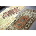 A quantity of decorative rugs,