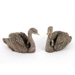 A filled silver model of a pair of swans,