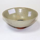 A stoneware bowl, by Henry Hammmond,