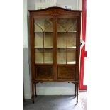 An Edwardian inlaid cabinet, on square taper legs with spade feet, 91.