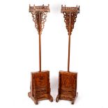 A pair of Thai candle stands,