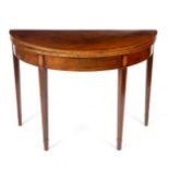 An early 19th Century D shaped card table, the top lined green baize,