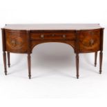 A Regency mahogany and crossbanded sideboard, on turned tapering legs,