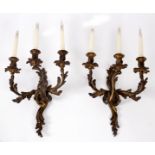 A pair of Louis XV style ormolu three-branch wall lights,
