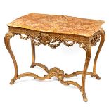 A gilded marble topped table of serpentine outline, decorated a central maskhead,