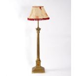 A Victorian brass standard lamp converted from an oil lamp,