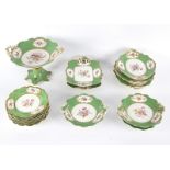 An English green-ground dessert service, circa 1840, comprising one tall tazza,