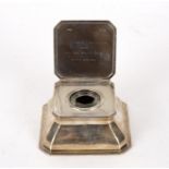 A silver inkwell, Goldsmiths & Silversmiths Co Ltd, London 1902, canted square form,