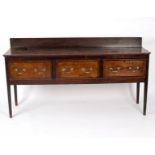 An 18th Century oak dresser fitted three drawers, on square taper legs,