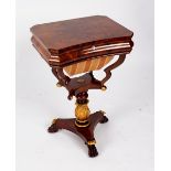 A Victorian mahogany sewing table with concave front,