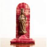 A Flemish bronze figure of the Virgin Mary, circa 1400, mounted on red velvet back-board,