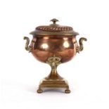 A copper samovar with ivory handles, gadrooned top and on square plinth with ball feet,