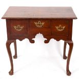 A George III oak kneehole fitted a surround of three drawers, on cabriole legs with pad feet, 81.