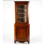 An Edwardian mahogany floor standing corner cupboard,