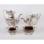 An electroplated four-piece tea and coffee service of oblong form,